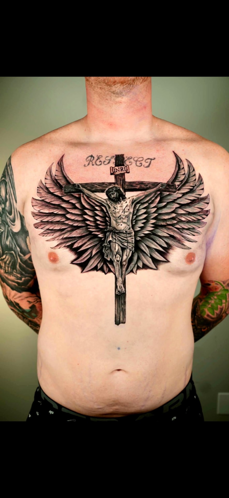 Black and grey realism Jesus on cross with angel wings chest tattoo by Kent Harrison