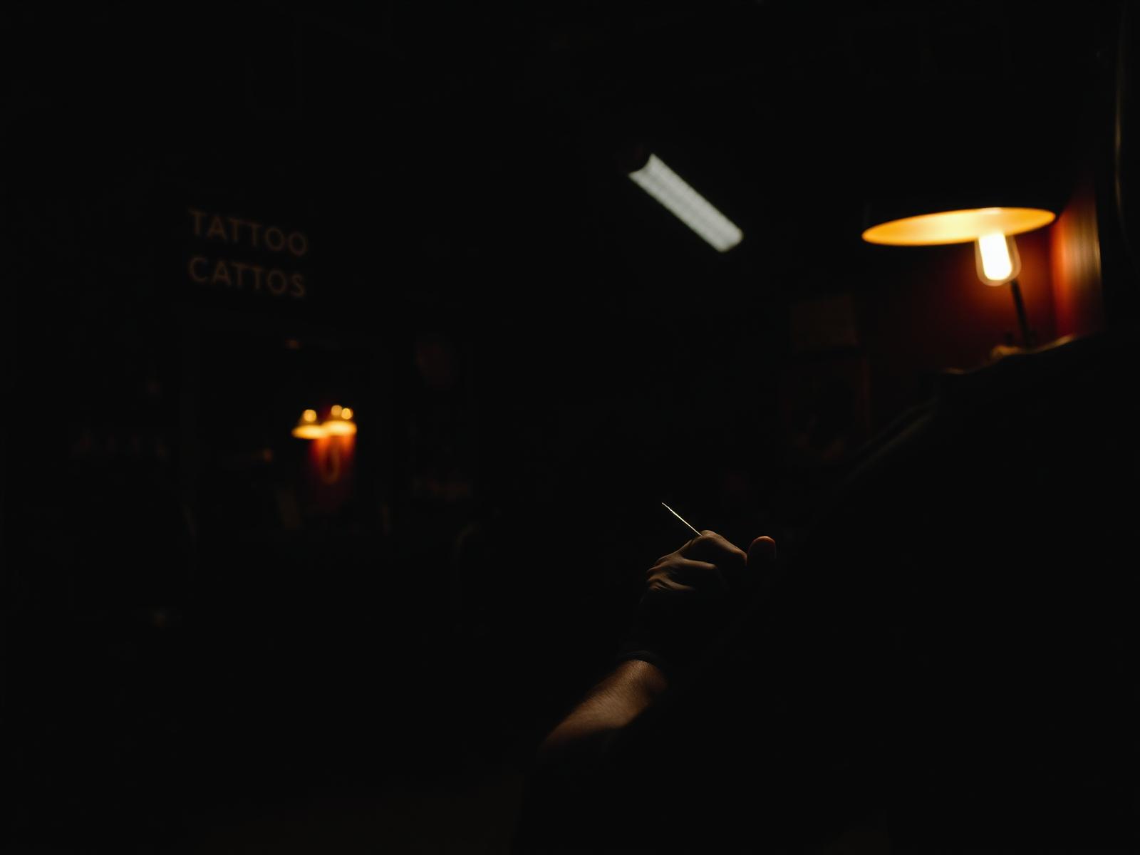 Tattoo artist at work at Ink Invasion